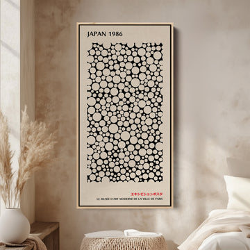 Japanese wall art polka dot pattern vertical tall canvas in a wood floating frame displayed in a living room