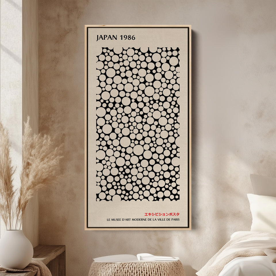 Japanese wall art polka dot pattern vertical tall canvas in a wood floating frame displayed in a living room