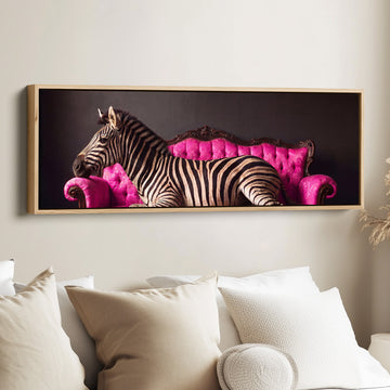 Bold and Playful Zebra on a Pink Velvet Sofa Long Wall Art for Living Room canvas in an oak frame, above the bed