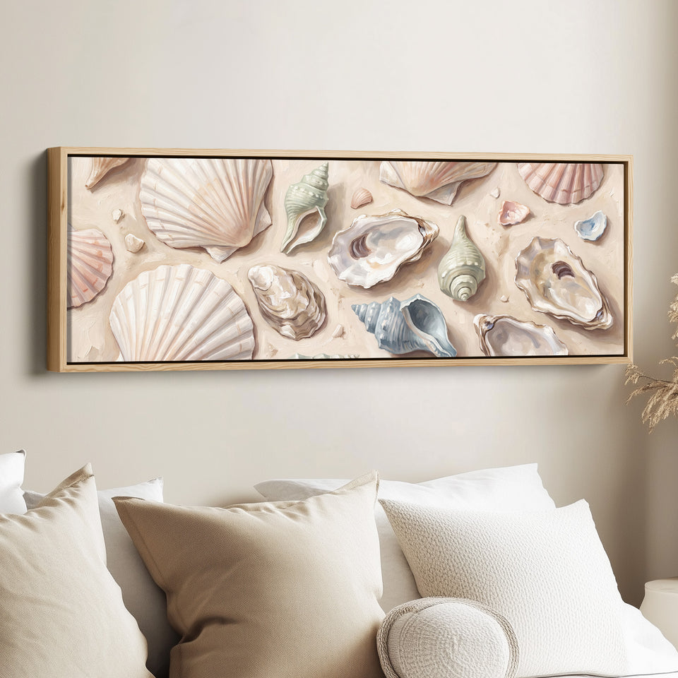 Long Wall Art Seashells on Sand Neutral Coastal Canvas for Above Bed canvas in an oak frame, above the bed