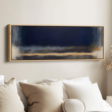 Office Wall Art Large Horizontal Moody Navy Colour Field Abstract canvas in an oak frame, above the bed