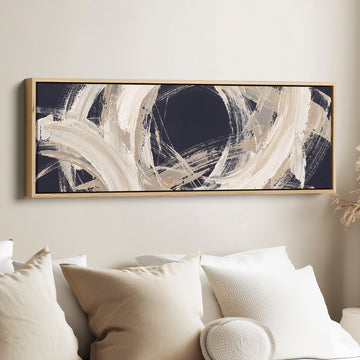 Modern Graphic Brushstroke Circle Abstract Long Wall Art for Living Room canvas in an oak frame, above the bed