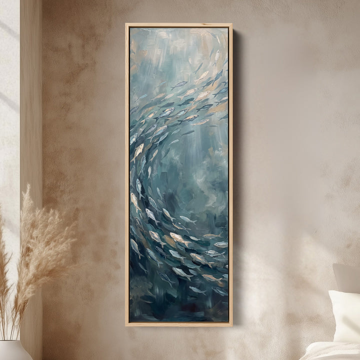 Vertical Wall Art Swirling Shoal of Fish Underwater for Hallway canvas in an oak frame, above the bed in a modern bedroom
