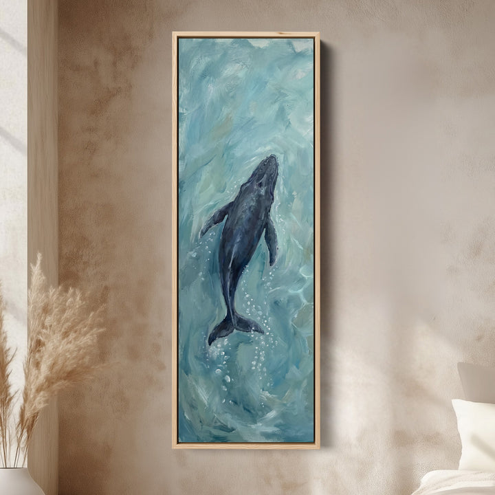 Deep Blue Ocean Diving Whale Long Narrow Wall Art for Bedroom canvas in an oak frame, above the bed in a modern bedroom