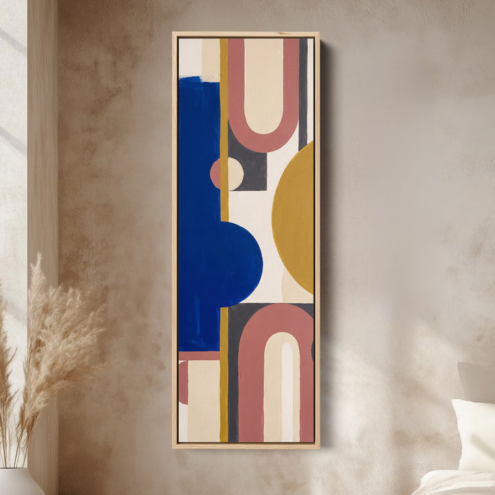 Bold Bauhaus Arches Vertical Wall Art in Cobalt Blue for Living Room canvas in an oak frame, above the bed in a modern bedroom