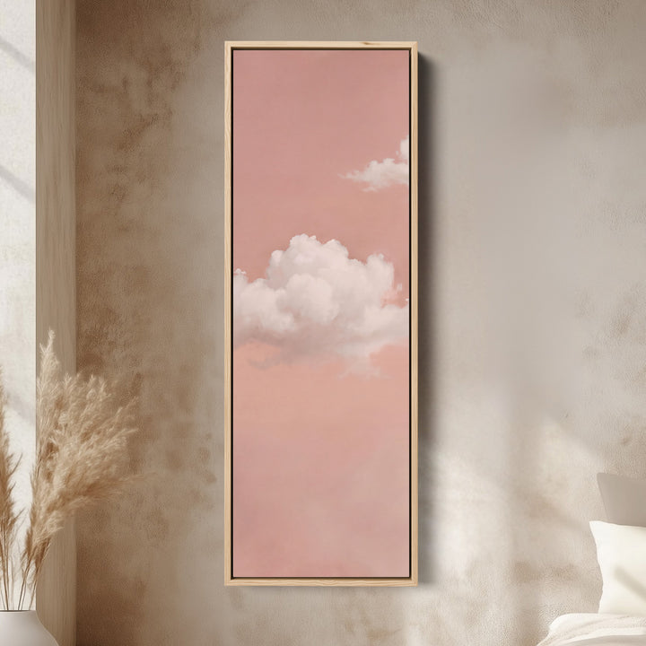 Clouds on Blush Pink Tall Wall Art for Bedroom canvas in an oak frame, above the bed in a modern bedroom