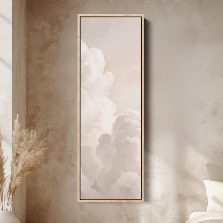 Soft Neutral Billowing White Clouds Tall Narrow Wall Art for Living Room canvas in an oak frame, above the bed in a modern bedroom