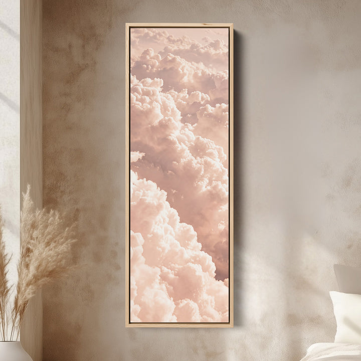 Long Narrow Wall Art Blush Pink Cloudscape for Bedroom canvas in an oak frame, above the bed in a modern bedroom