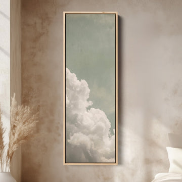 White Clouds on a Sage Sky Vertical Wall Art for Living Room canvas in an oak frame, above the bed in a modern bedroom
