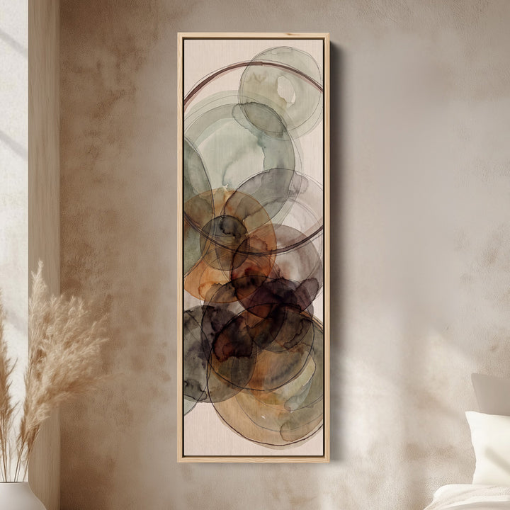 Tall Wall Art Rust and Sage Watercolor Circles Abstract for Dining Room canvas in an oak frame, above the bed in a modern bedroom