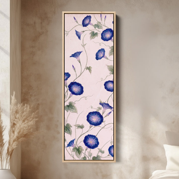 Living Room Wall Art Tall Narrow Blue Morning Glory Vines canvas in an oak frame, above the bed in a modern bedroom
