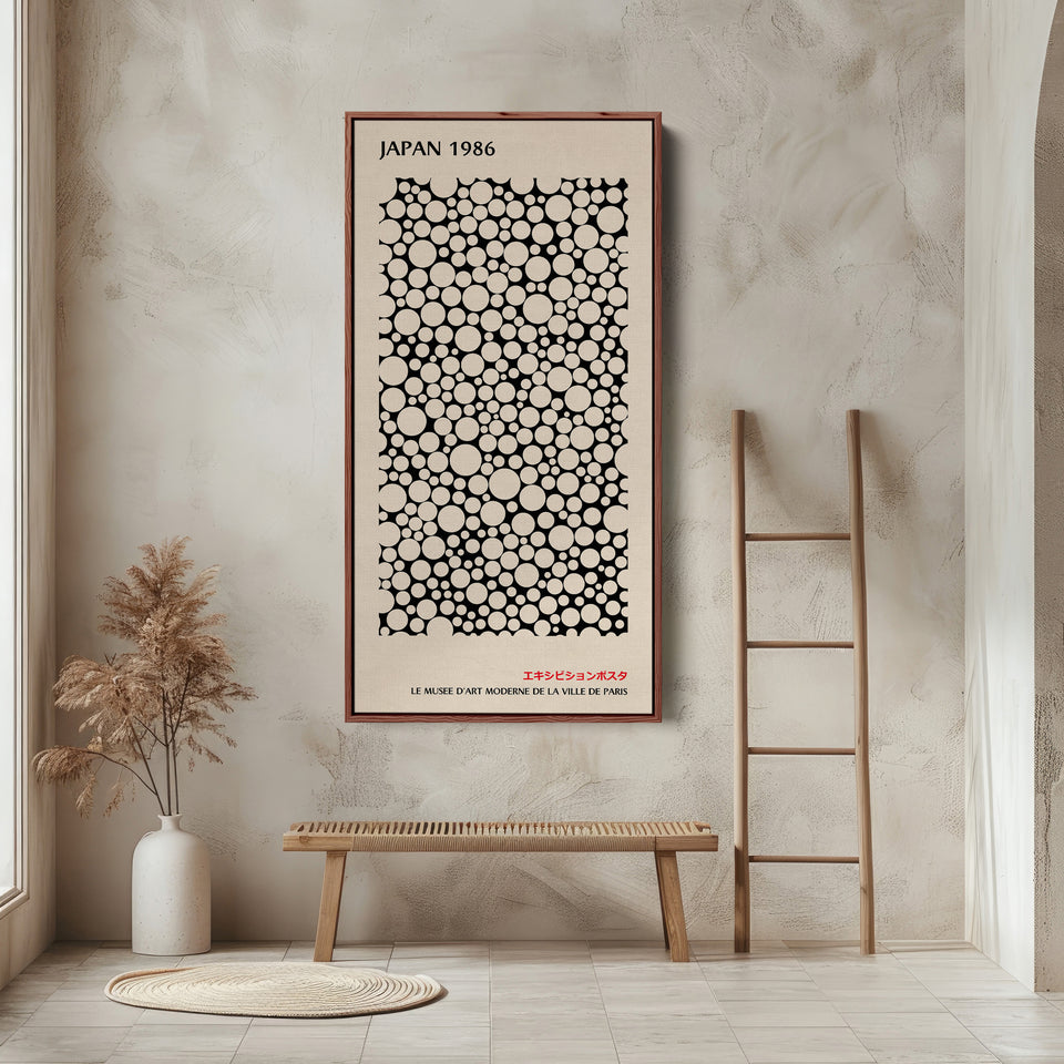 Japanese wall art polka dot pattern vertical tall canvas in a walnut floating frame displayed in a living room