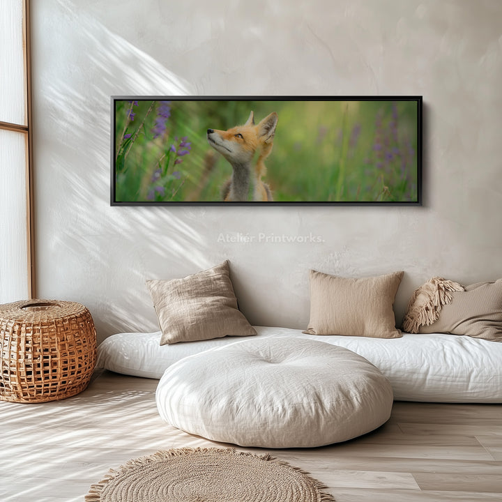 Above bed art fox in meadow looking upward among soft greenery for living room or bedroom