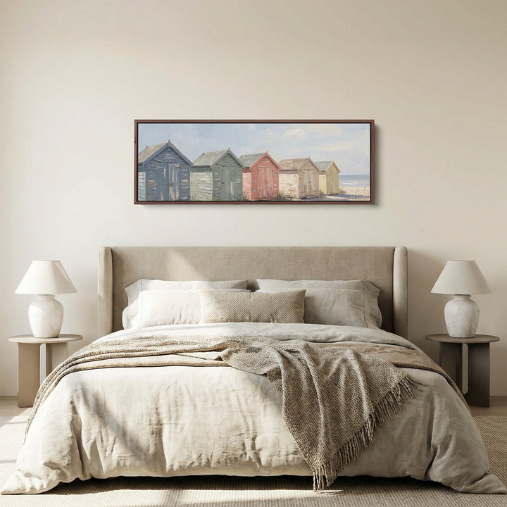 Above Bed Wall Art Panoramic Pastel Beach Huts by the Sea panoramic canvas in a walnut frame, above the bed
