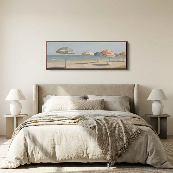 Living Room Wall Art Long Horizontal Canvas of Beach Umbrellas panoramic canvas in a walnut frame, above the bed