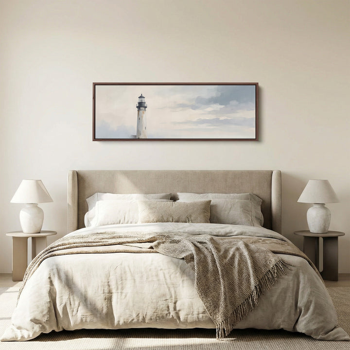 Hallway Wall Art Long Narrow Minimalist Lighthouse Under a Grey Sky panoramic canvas in a walnut frame, above the bed