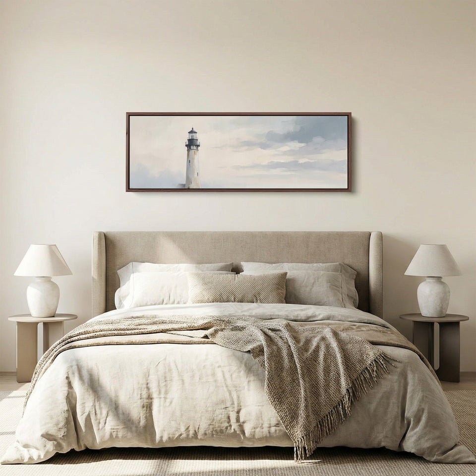 Hallway Wall Art Long Narrow Minimalist Lighthouse Under a Grey Sky panoramic canvas in a walnut frame, above the bed