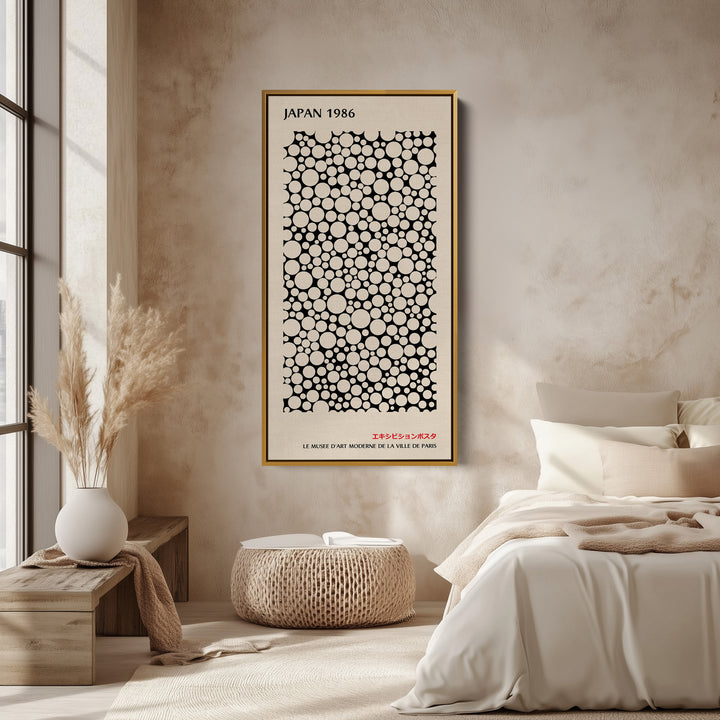 Japanese wall art polka dot pattern vertical tall canvas in a gold floating frame displayed in a living room