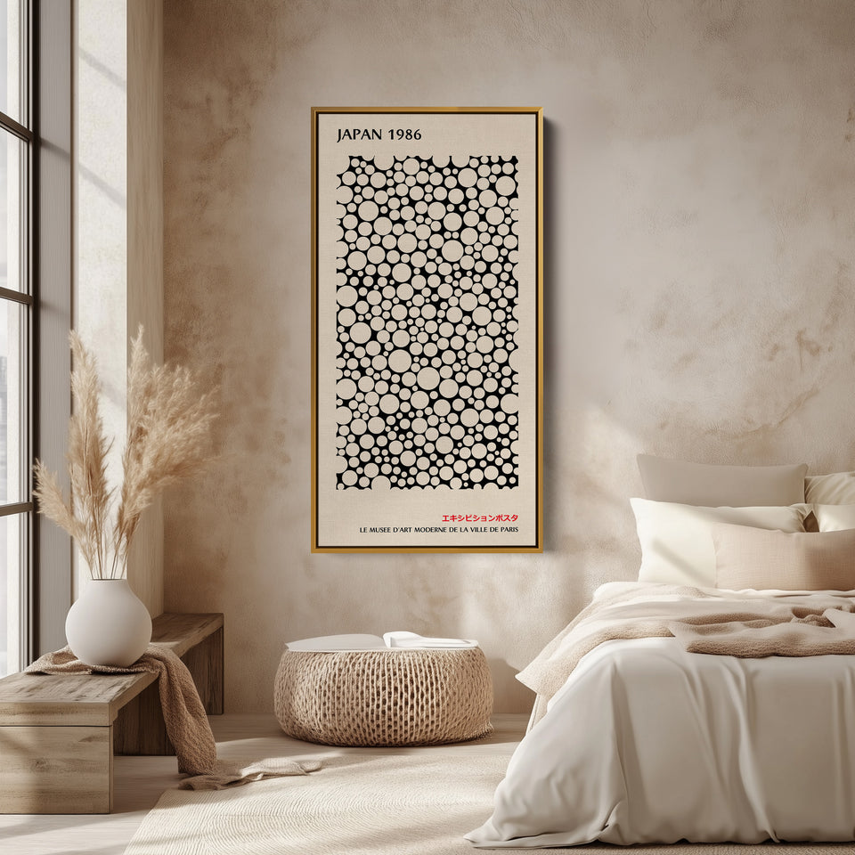 Japanese wall art polka dot pattern vertical tall canvas in a gold floating frame displayed in a living room