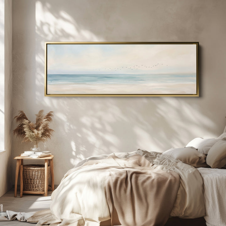 Panoramic Wall Art Calm Sea and Shoreline with Birds for Bedroom wall art in a gold frame, above the bed