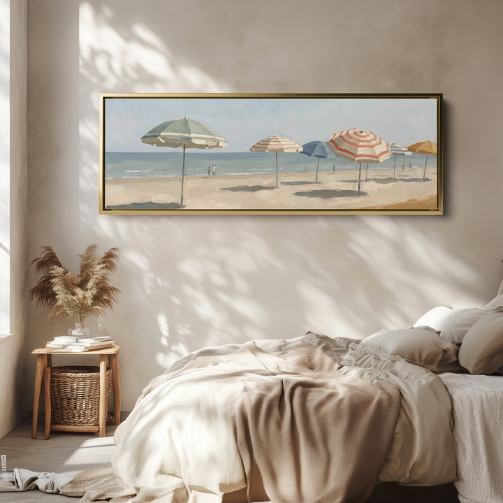 Living Room Wall Art Long Horizontal Canvas of Beach Umbrellas wall art in a gold frame, above the bed