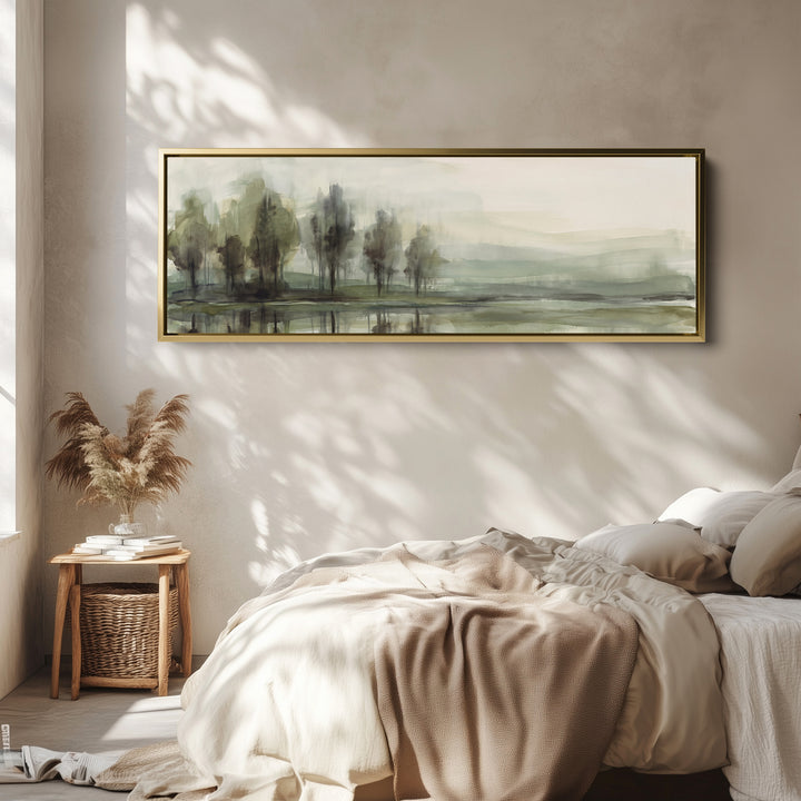 Horizontal Wall Art Watercolor Trees by a Still Lake for Living Room wall art in a gold frame, above the bed