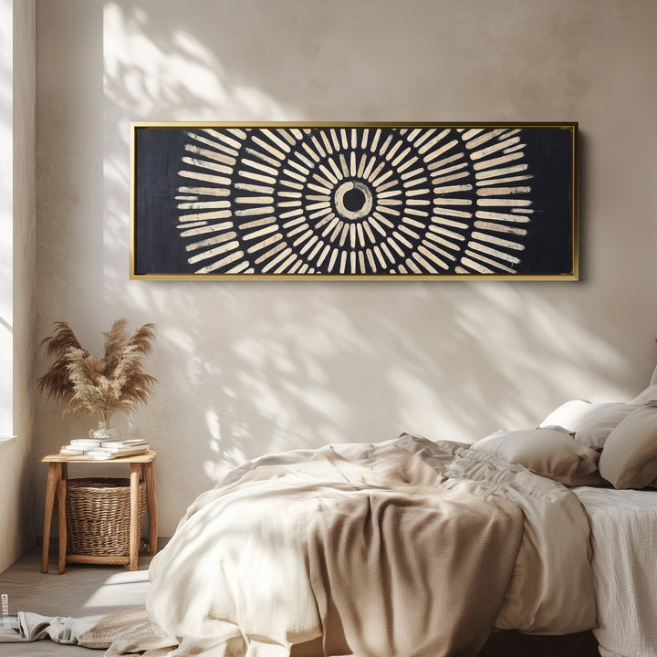 Living Room Wall Art Long Narrow Black Sunburst Geometric Canvas wall art in a gold frame, above the bed