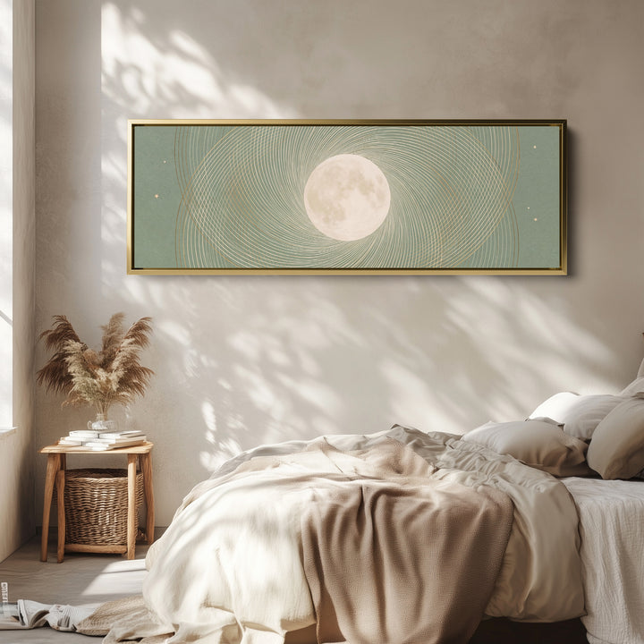 Above Couch Wall Art Panoramic Sage Full Moon Celestial Canvas wall art in a gold frame, above the bed