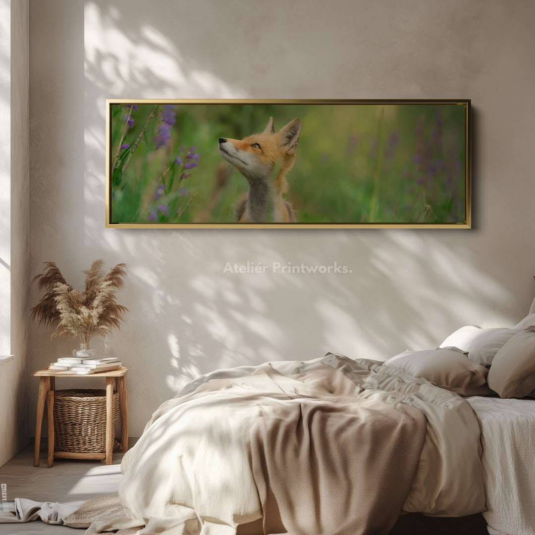 Above bed art fox in meadow looking upward among soft greenery for living room or bedroom