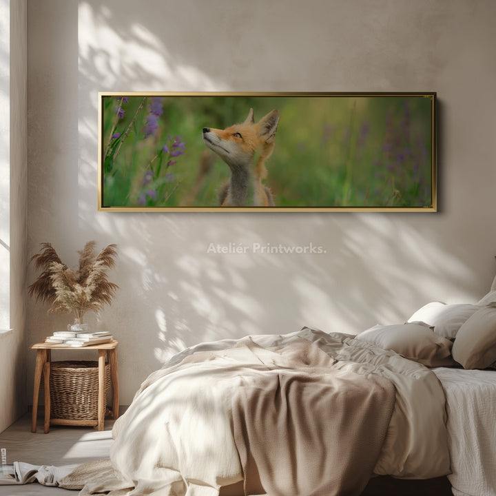 Above bed art fox in meadow looking upward among soft greenery for living room or bedroom