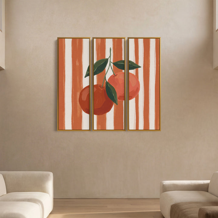 Tableau mural vertical en 3 parties représentant deux oranges sur un fond rayé, pour une cuisine