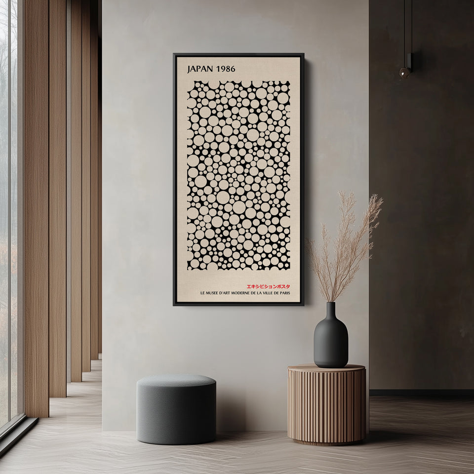 Japanese wall art polka dot pattern vertical tall canvas in a black floating frame displayed in a living room
