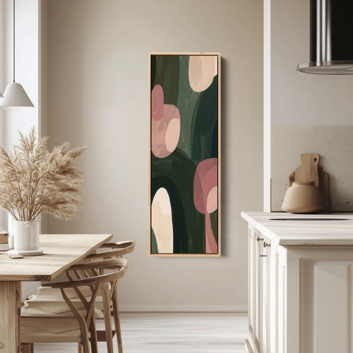 Living Room Wall Art Vertical Pink and Green Abstract Shapes tall canvas in an oak frame, hung in a bright kitchen