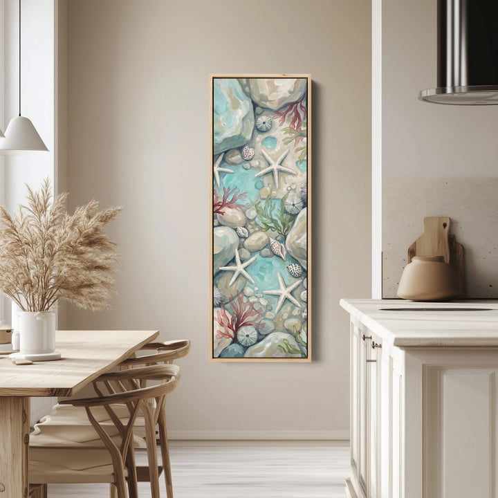Tall Narrow Wall Art Rock Pool with Starfish and Shells for Hallway tall canvas in an oak frame, hung in a bright kitchen