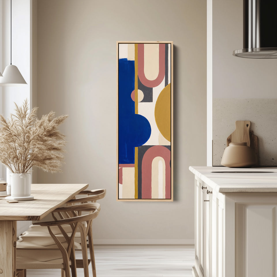 Bold Bauhaus Arches Vertical Wall Art in Cobalt Blue for Living Room tall canvas in an oak frame, hung in a bright kitchen