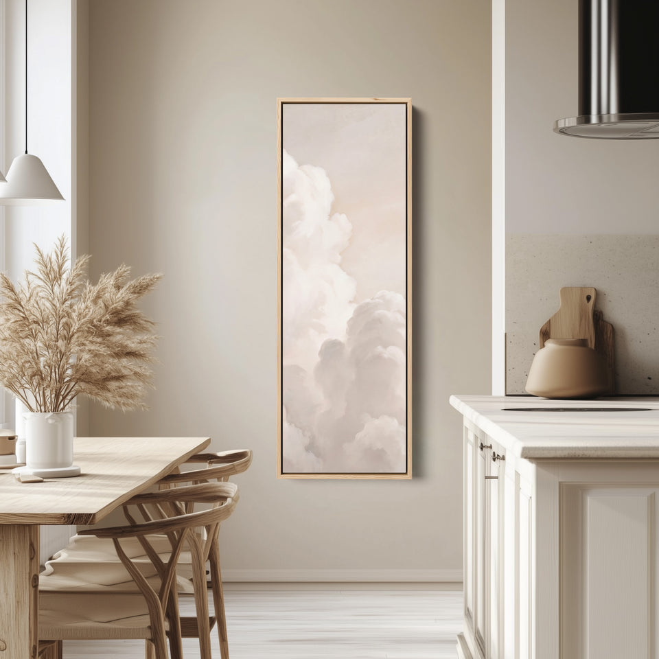 Soft Neutral Billowing White Clouds Tall Narrow Wall Art for Living Room tall canvas in an oak frame, hung in a bright kitchen