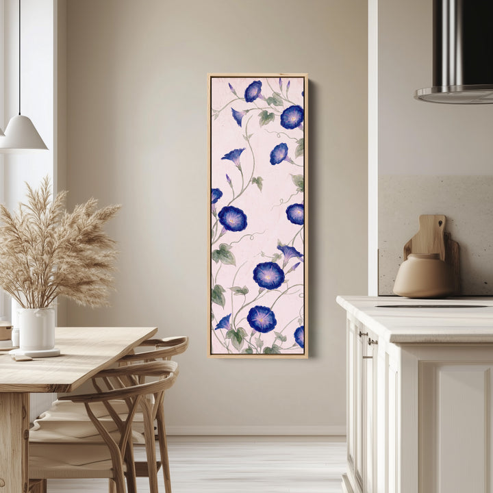 Living Room Wall Art Tall Narrow Blue Morning Glory Vines tall canvas in an oak frame, hung in a bright kitchen