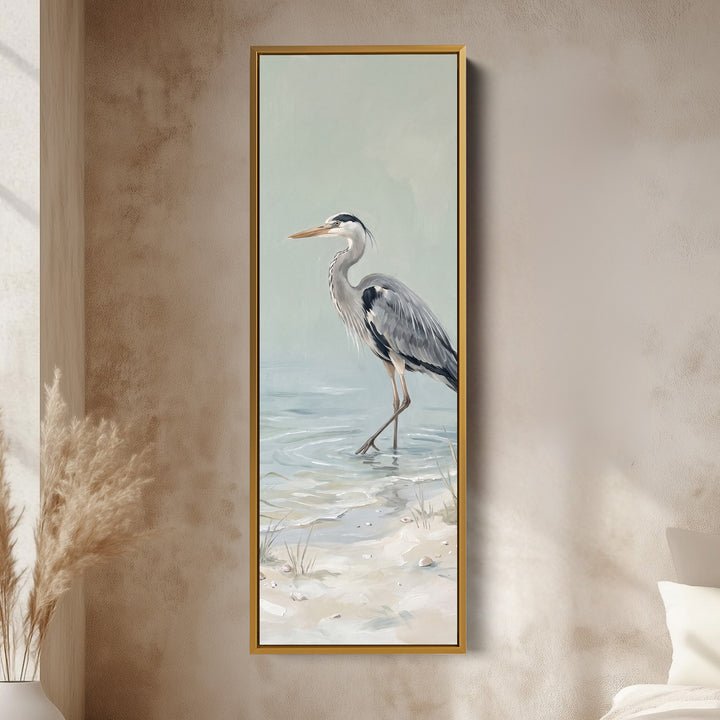 Grey Heron Wading Tall Wall Art Coastal Canvas for Living Room vertical wall art shown in a gold frame