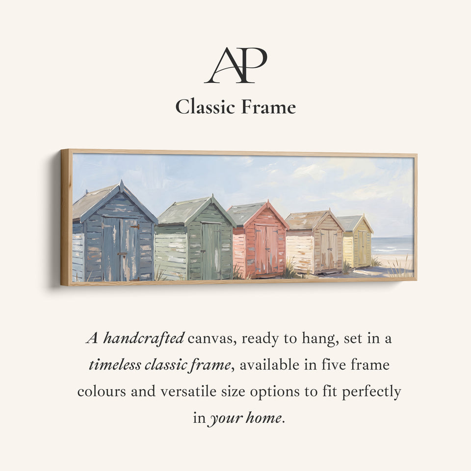 Corner detail of the Above Bed Wall Art Panoramic Pastel Beach Huts by the Sea canvas in a classic frame