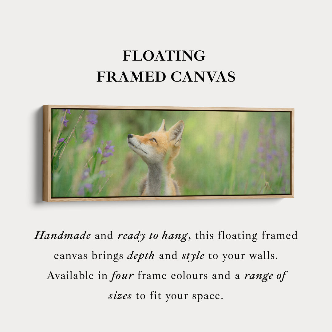 Above bed art fox in meadow looking upward among soft greenery for living room or bedroom