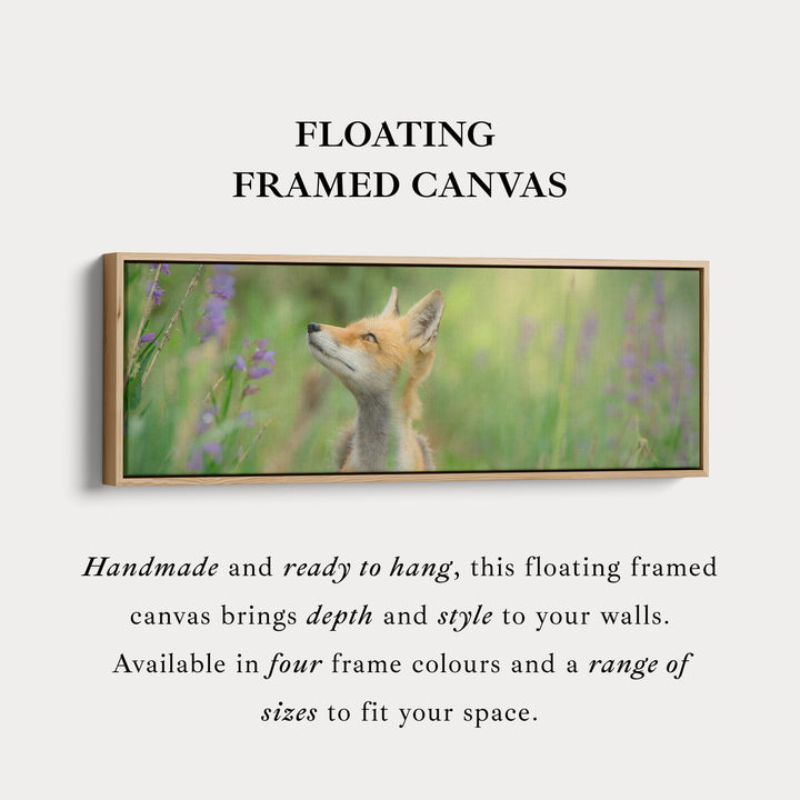 Above bed art fox in meadow looking upward among soft greenery for living room or bedroom