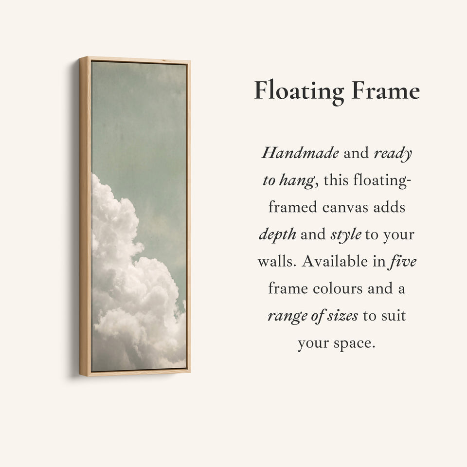 Corner detail of the White Clouds on a Sage Sky Vertical Wall Art for Living Room canvas in a floating frame