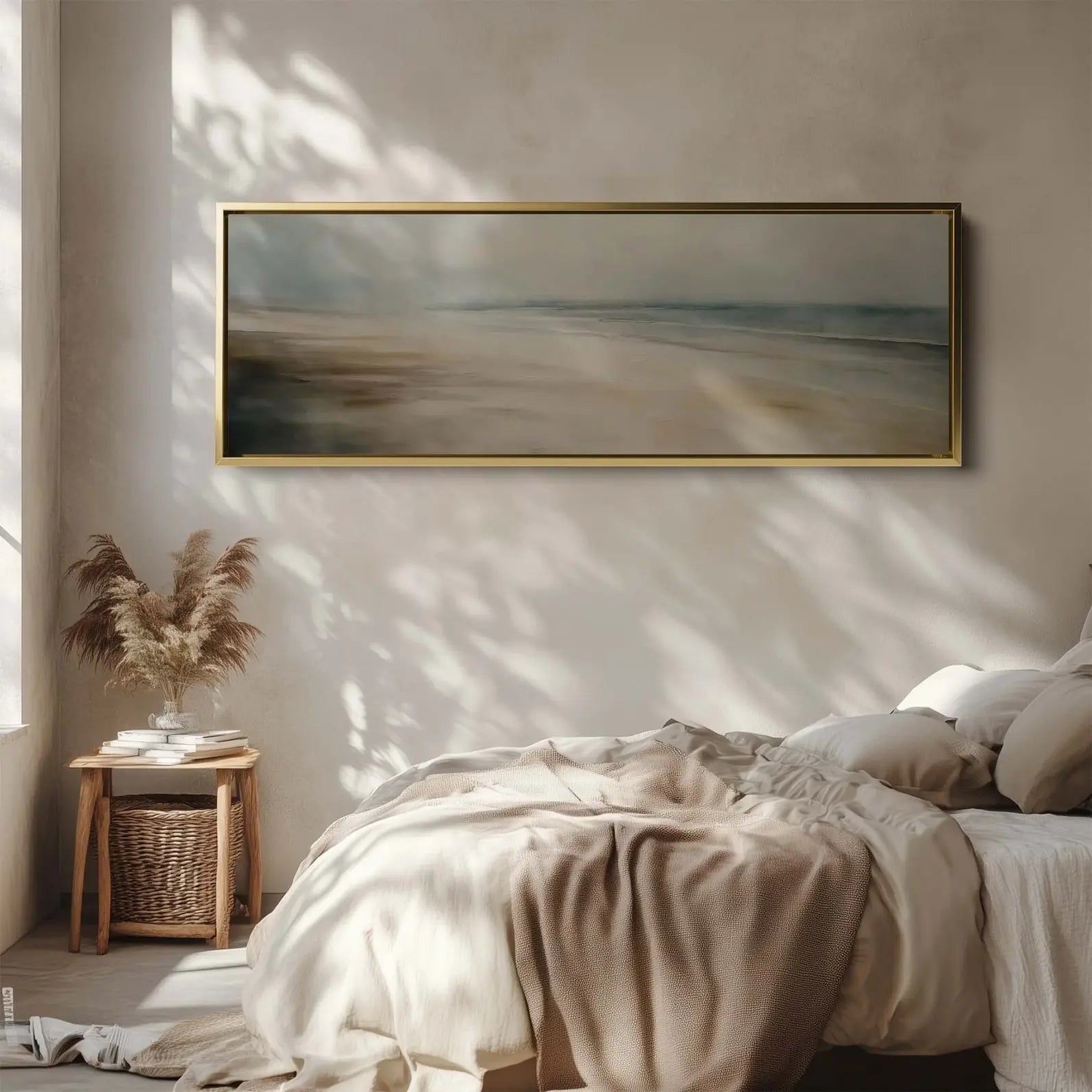 Beach scene painting on a wall above a bed in a bedroom
